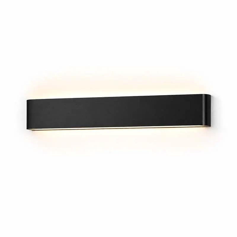 Minimalist LED Wall Light mounted on a white wall; black wall lamp emitting upward and downward light.