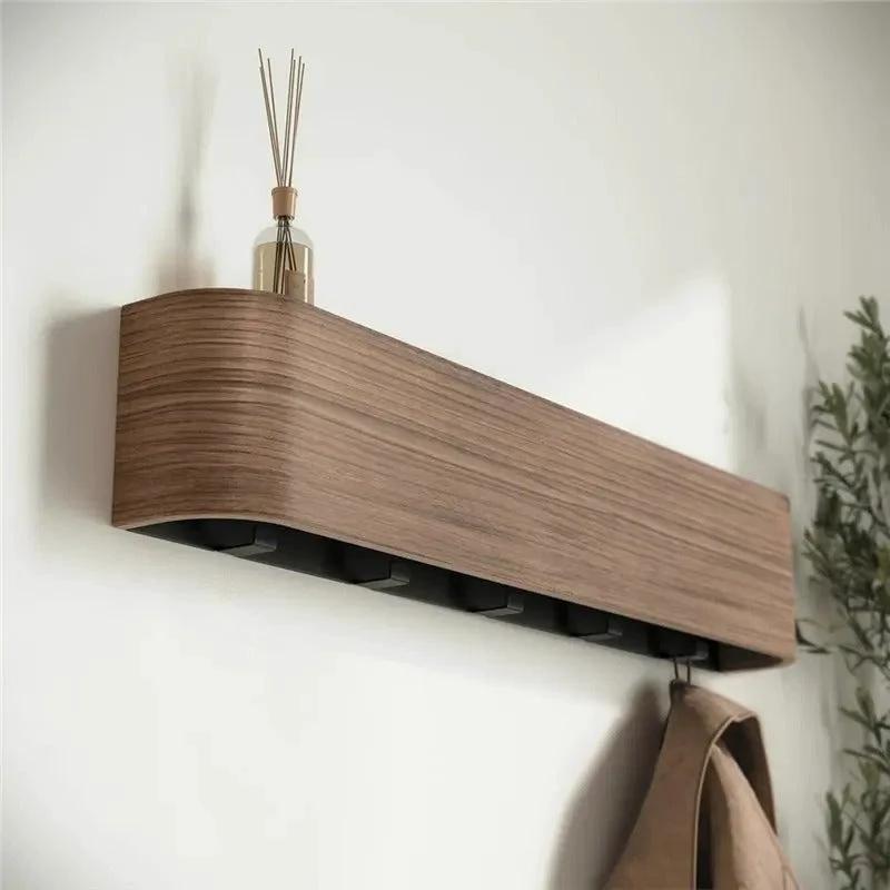 Wood & Iron Coat Rack with Hidden Hooks & Shelf mounted on an entryway wall for hanging coats