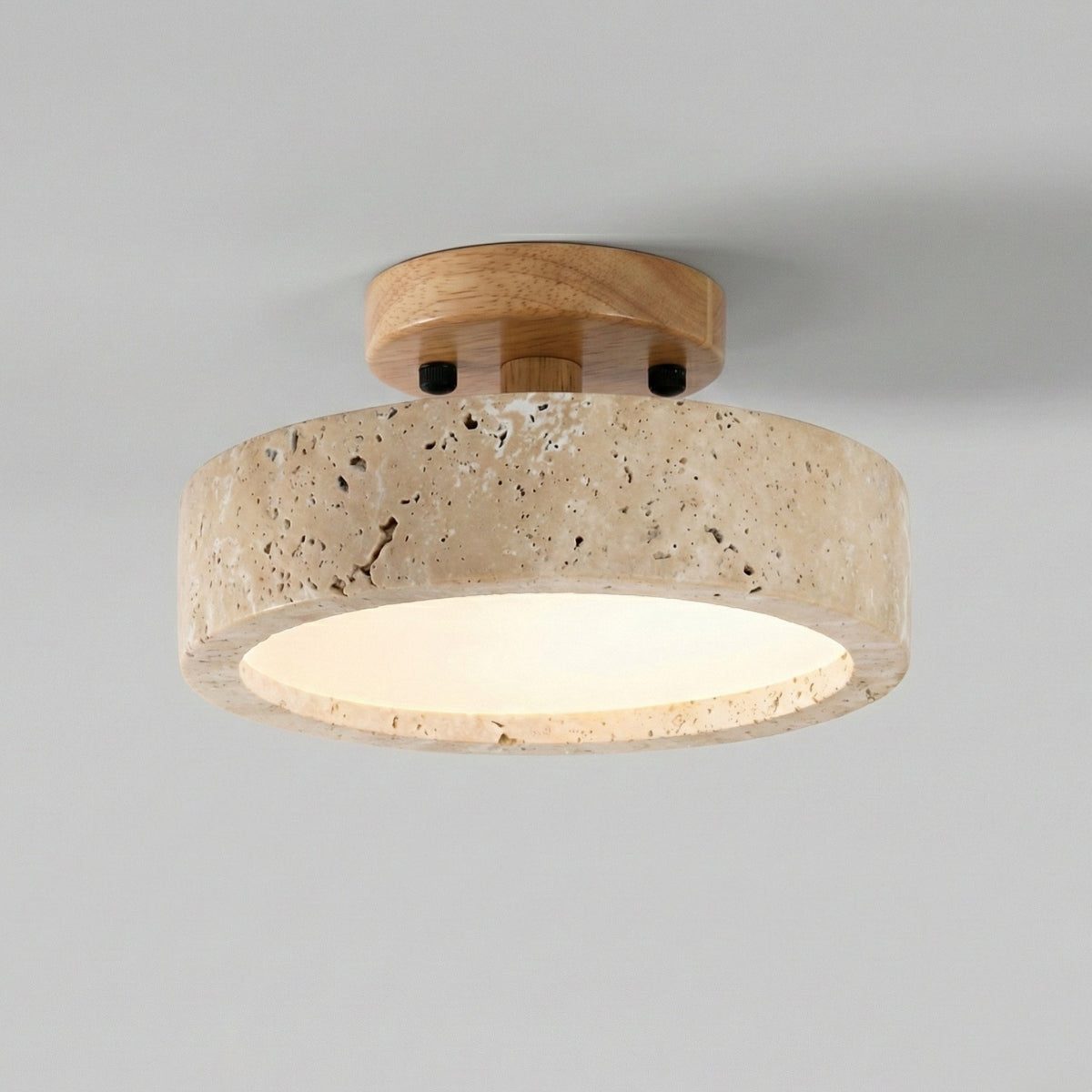 Ceiling light fixture with wooden top and beige stone-like base on a gray background