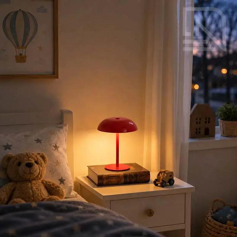 Red cordless mushroom table lamp providing warm bedside lighting in a modern children's bedroom