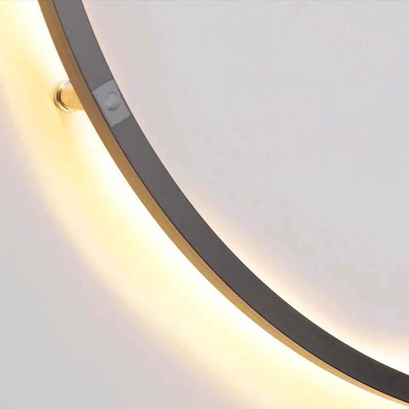 KRETS – Ring LED Wall Lamp mounted on a wall with warm glow and gold rim.