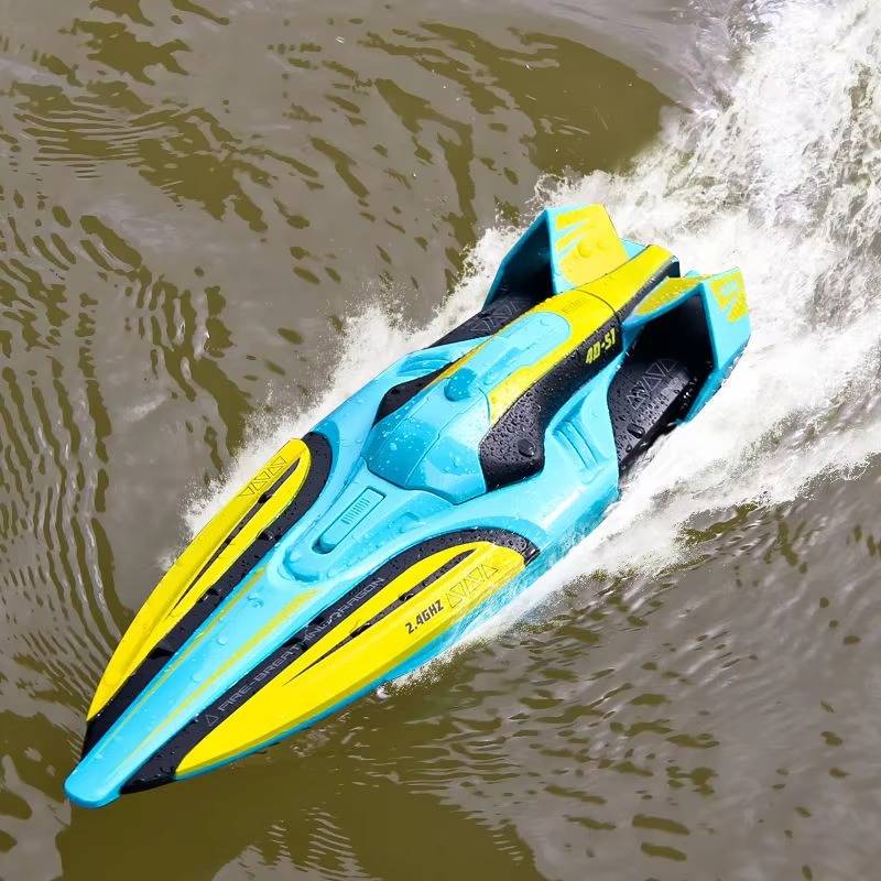 Green RC racing boat speeding across water, action shot