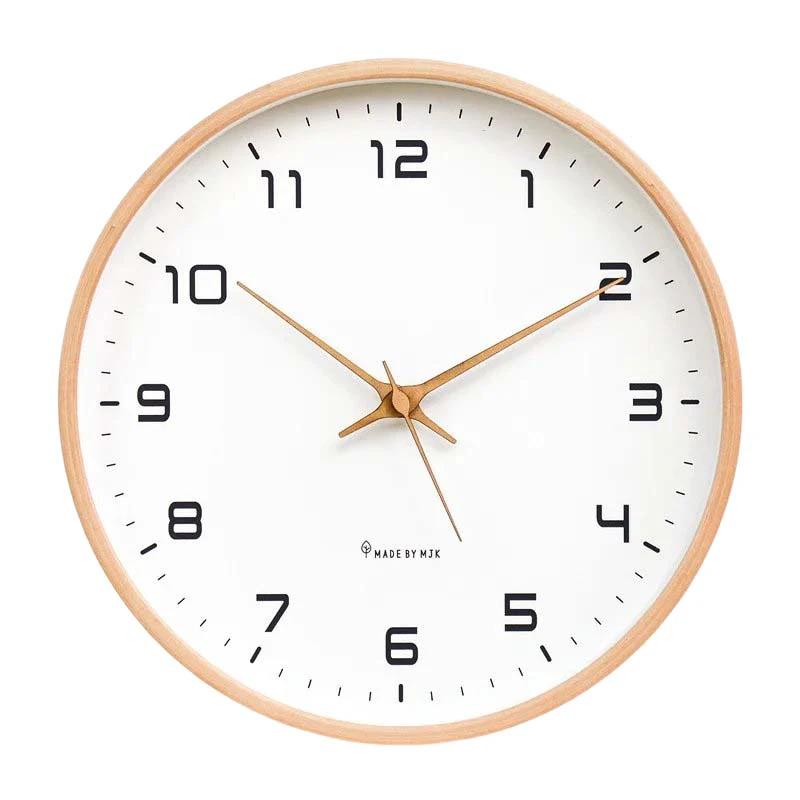 Nordic Wooden Wall Clock on white wall with wooden frame, white dial and copper hands; Made by MJK.
