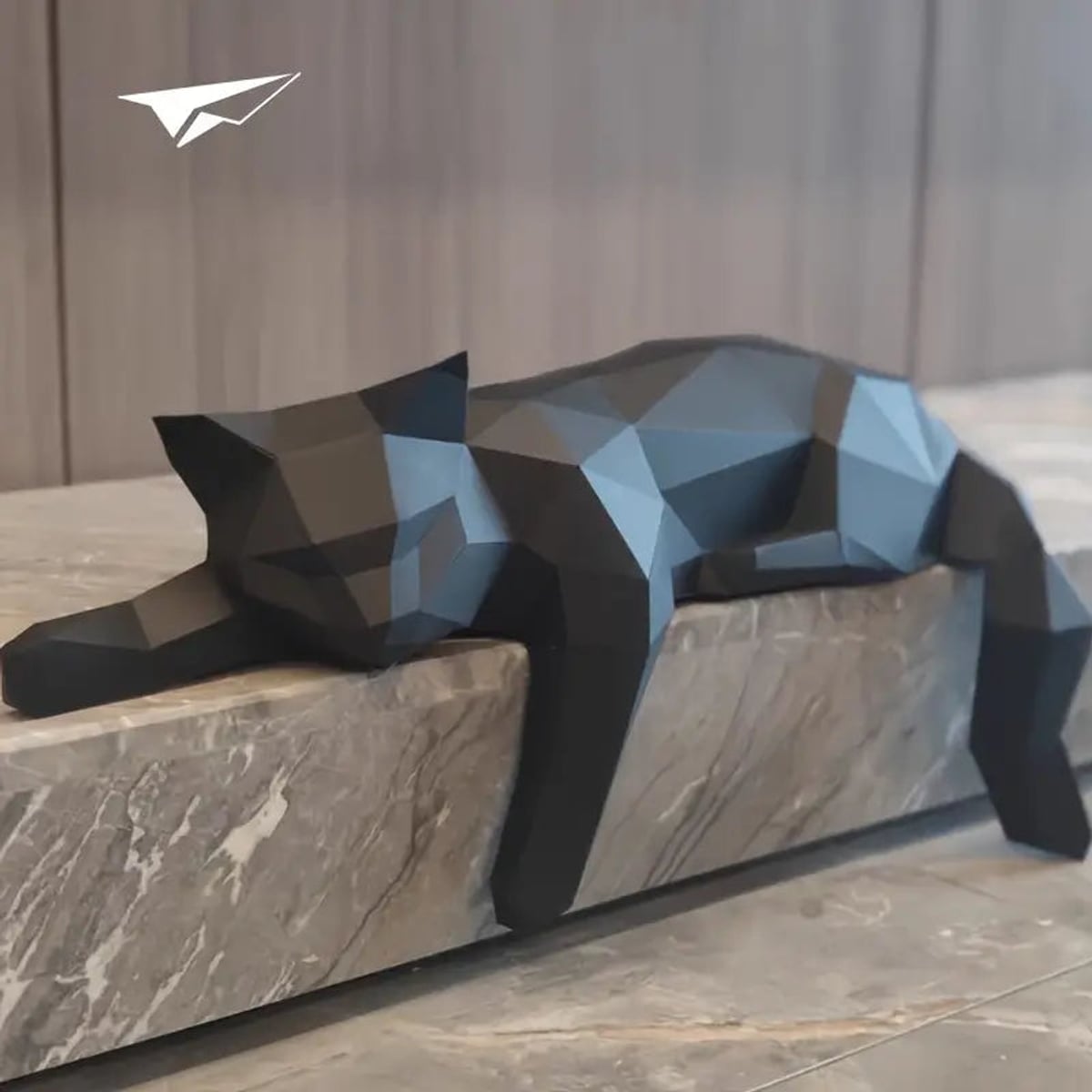low-poly sleeping cat sculpture