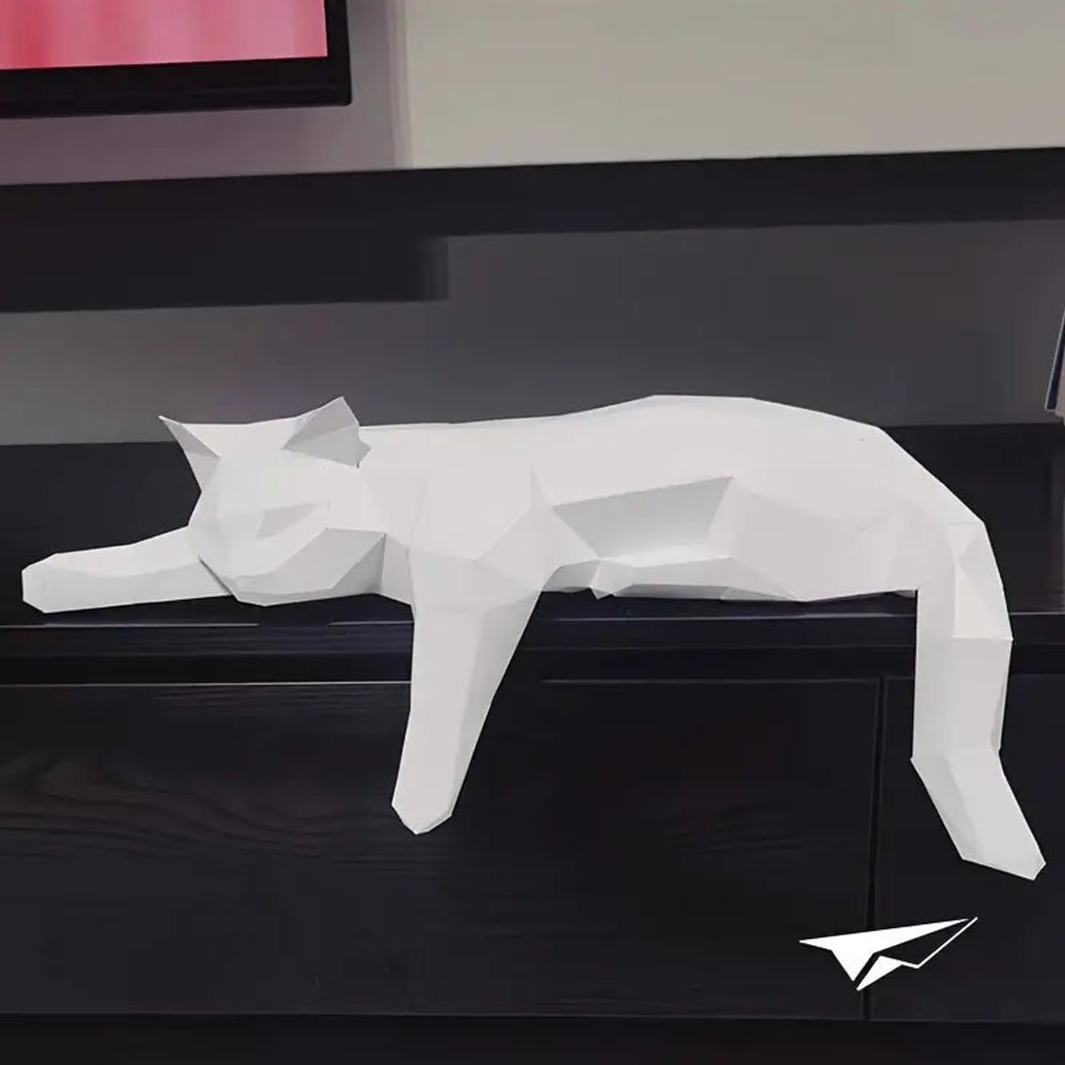low-poly sleeping cat sculpture