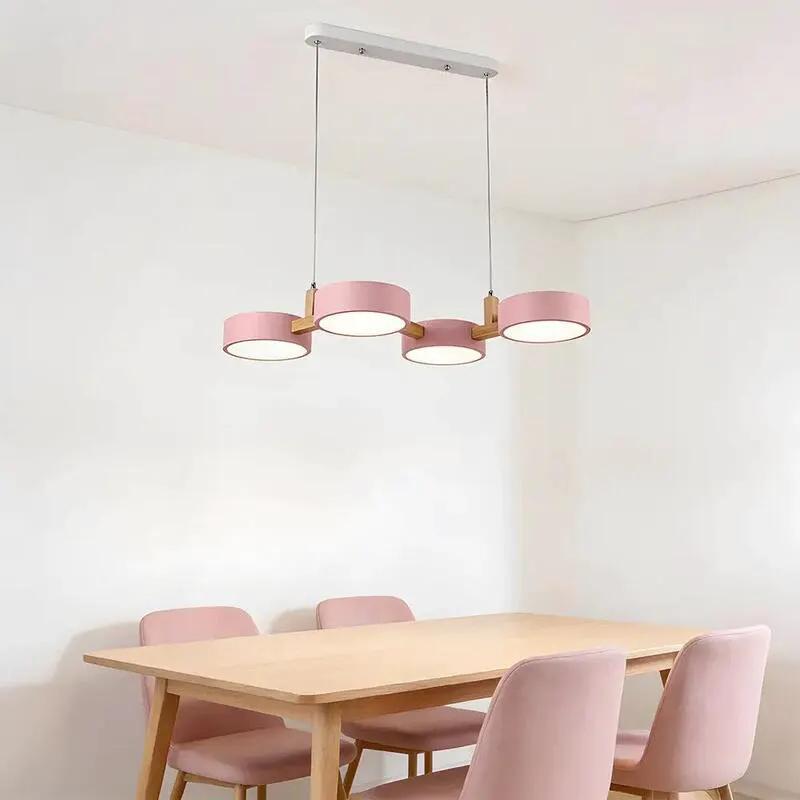 Nordic modern ceiling light with pink LED shades suspended above minimalist dining space (10795371266381)