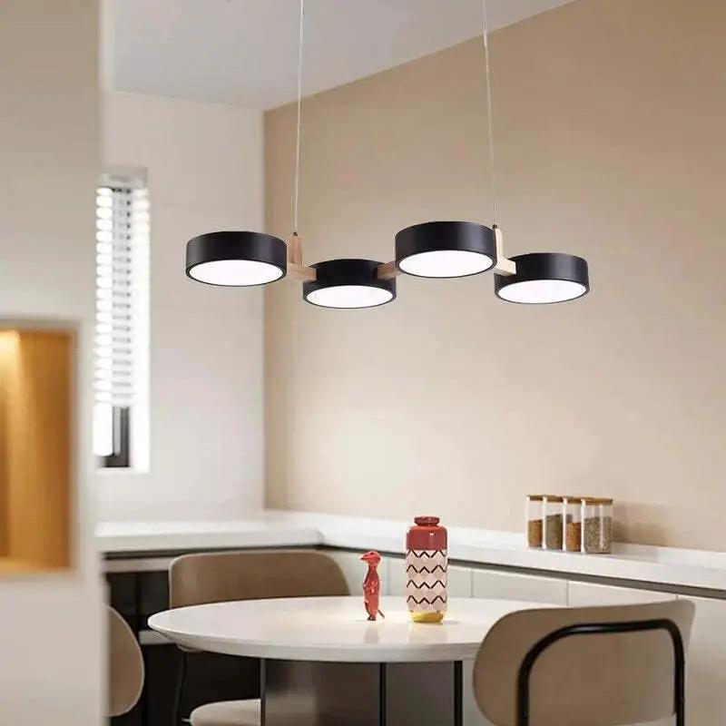 Modern Nordic pendant ceiling light with black circular LED shades for contemporary dining room lighting (10795371266381)