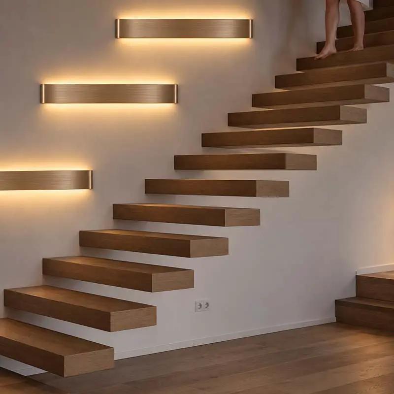 Modern floating wooden stairs with integrated linear LED wall lights in a minimalist interior setting, with a person's legs visible at the top.