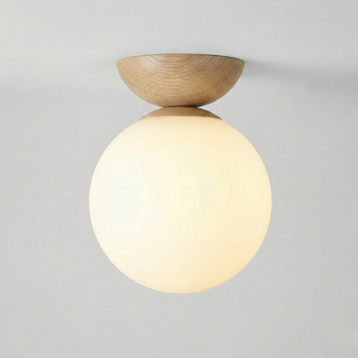 round japandi globe ceiling light in natural oak