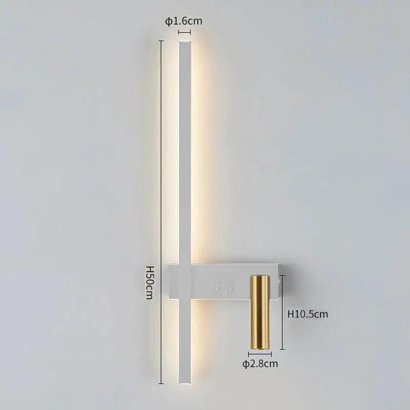 SVEA Swivel LED Wall Light mounted on a bedroom wall; white finish with warm LED strip and brass accent.
