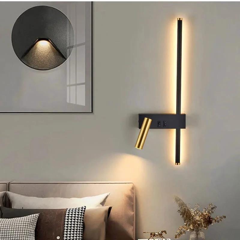Wall lights: vertical LED strip with brass adjustable reading arm on a dark wall sconce above a bed in bedroom.