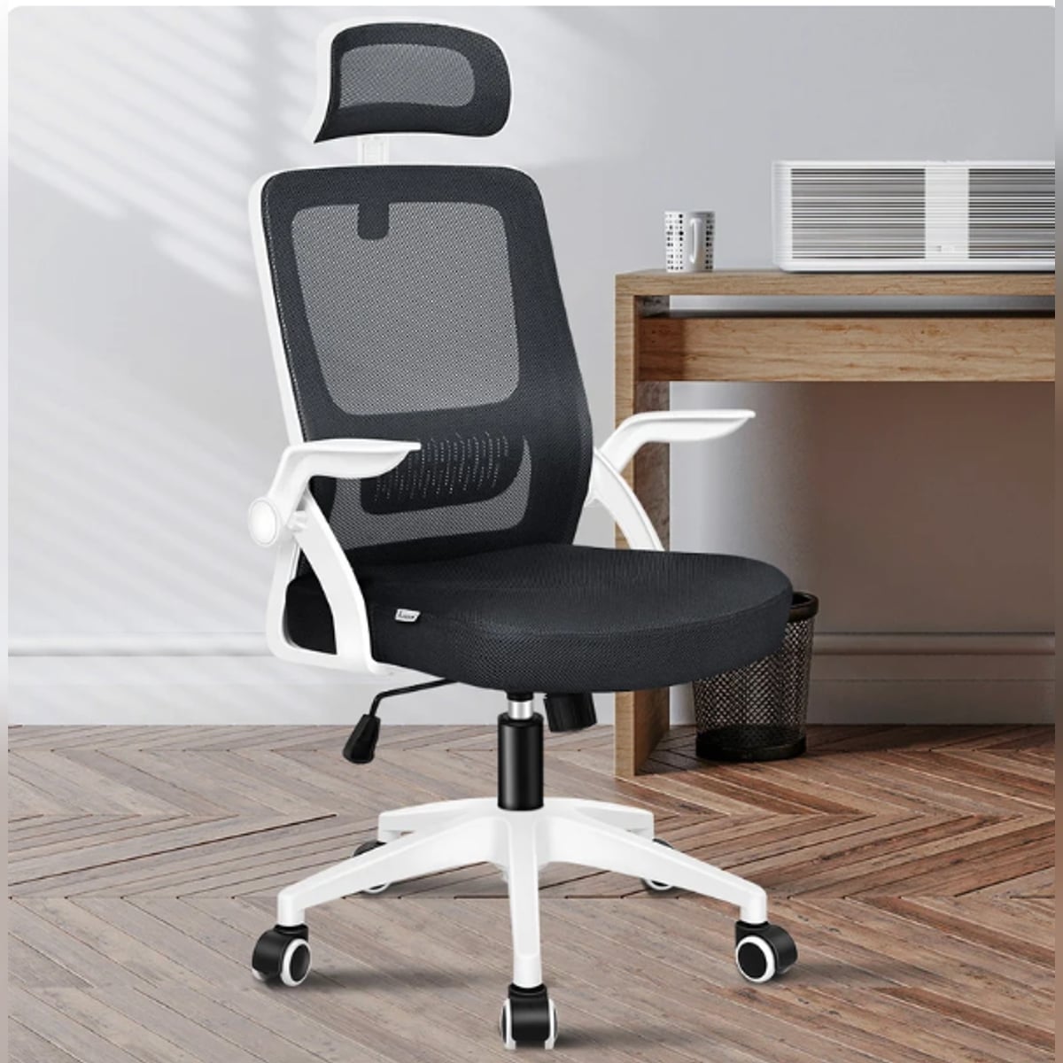 high-back mesh office chair with footrest and headrest in black & white