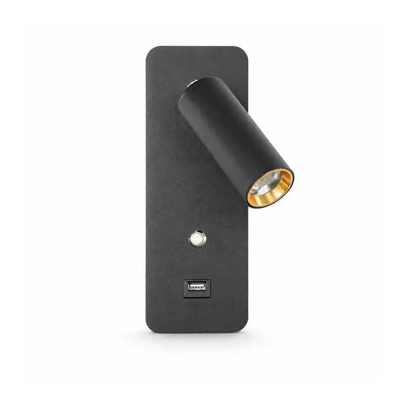 A modern black wall-mounted spotlight with a cylindrical adjustable head, a gold interior trim, and a small round button above a USB-C port on a white background.