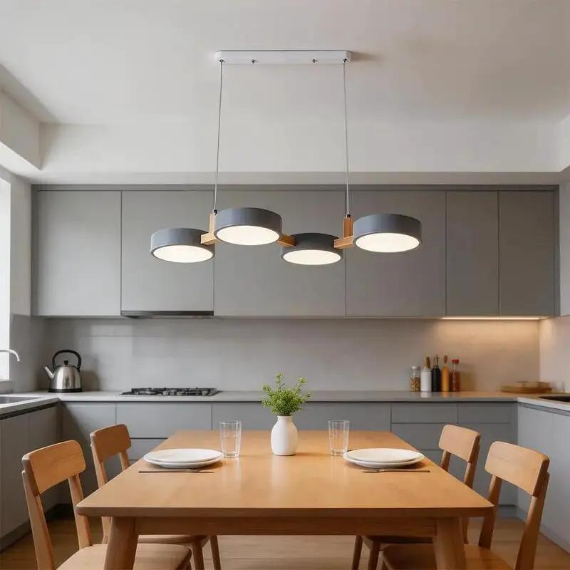Scandinavian linear pendant light above wooden dining table with soft diffused LED dining illumination (10795371266381)
