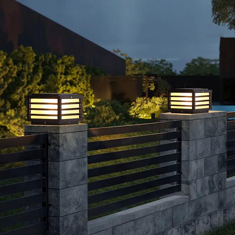 Waterproof solar fence post lights providing ambient evening lighting for a contemporary outdoor garden entrance